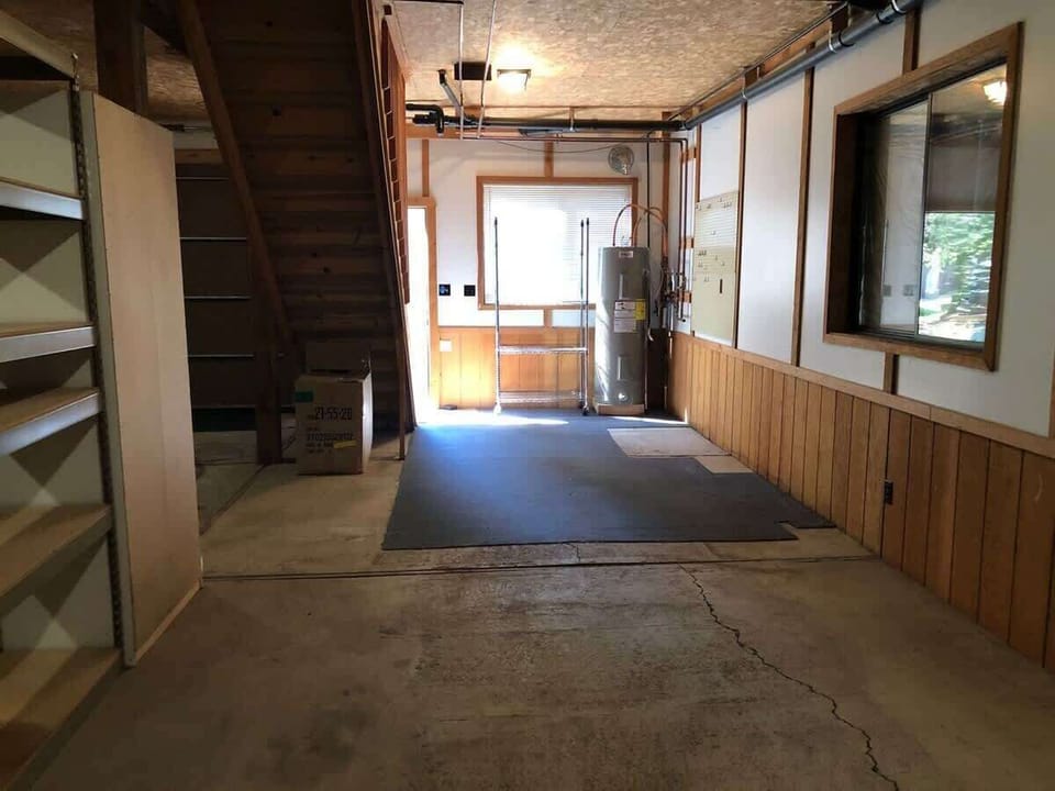 Open garage area below the cabin.