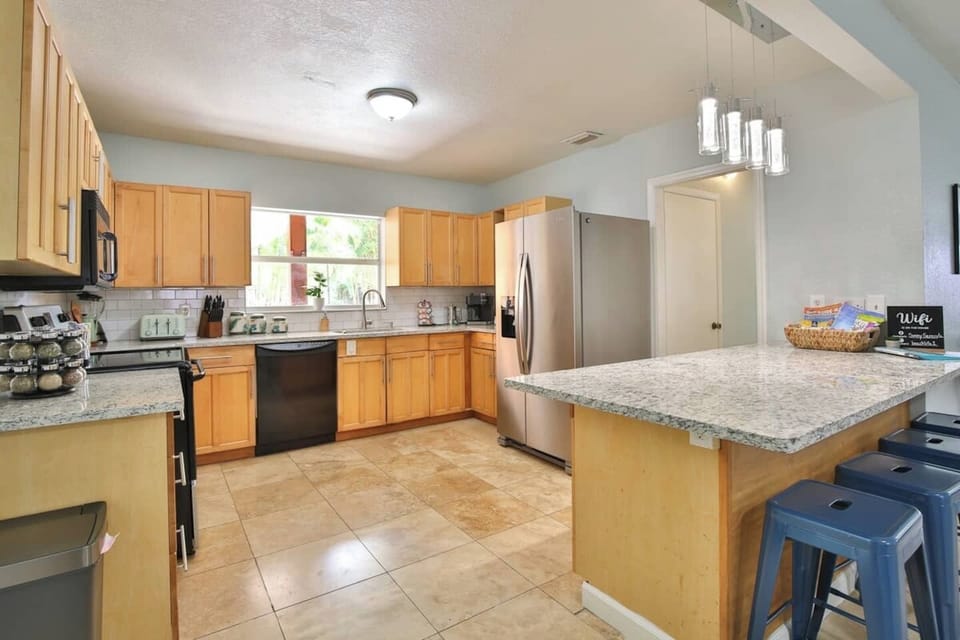 This island with stools is perfect for keeping the conversation flowing while making hors' d'oeuvres for the patio. Open kitchen offers plenty of space even for that special holiday meal.