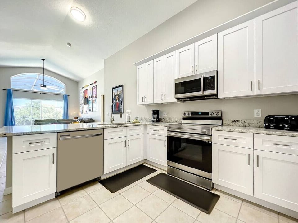 Beautifully remodeled and fully equipped kitchen featuring a variety of modern appliances.
