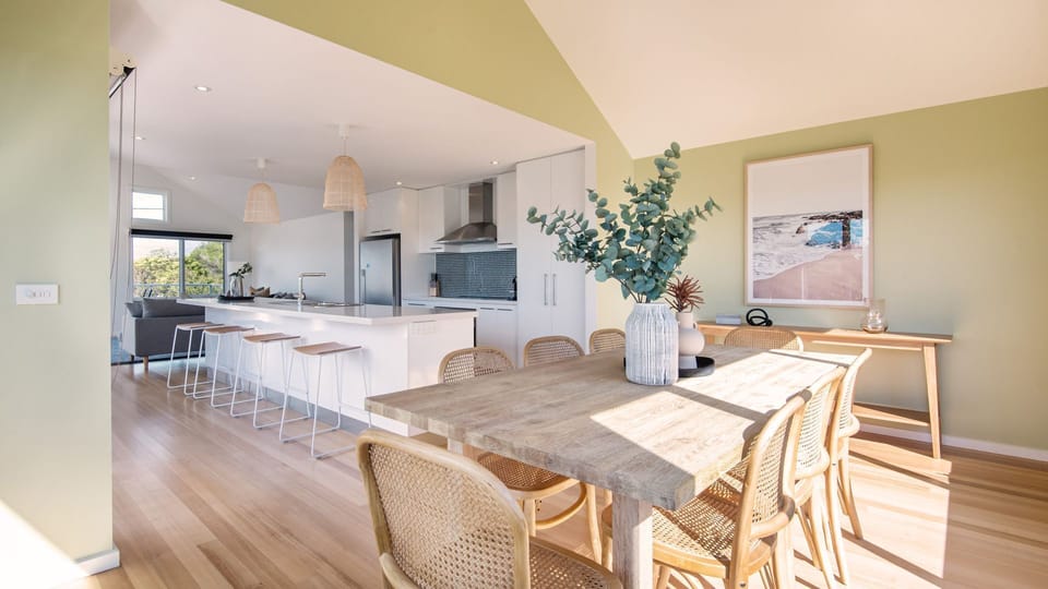 Open plan kitchen  with breakfast bar for 4 people and dining for 8 people