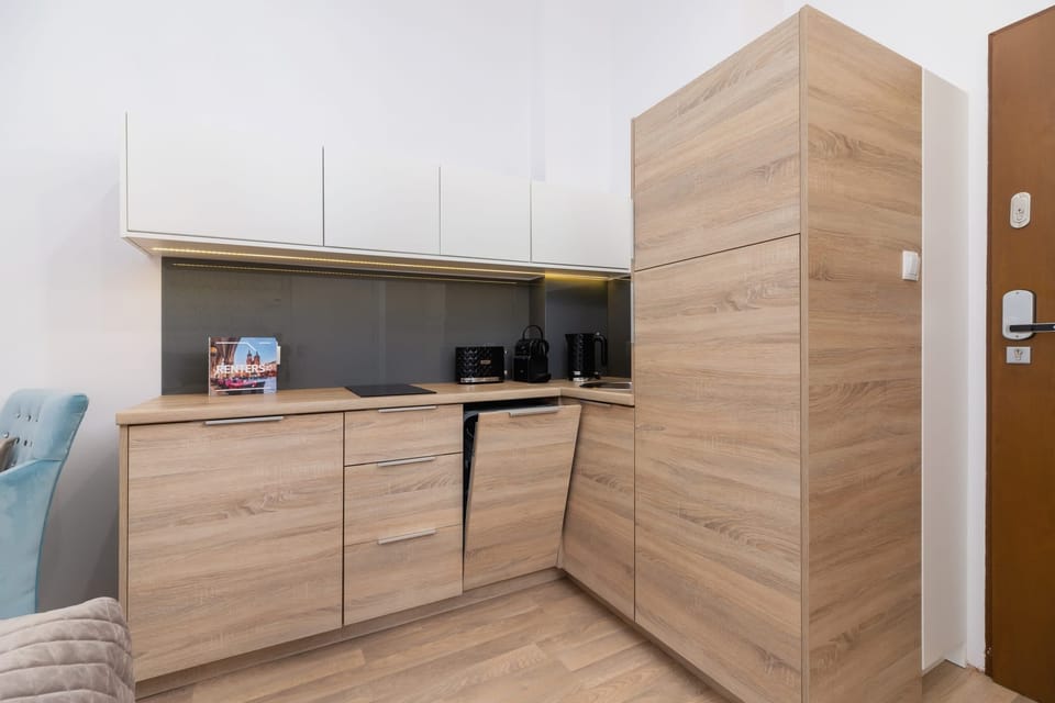 The fully equipped kitchenette includes everything you need for a home-cooked meal.
