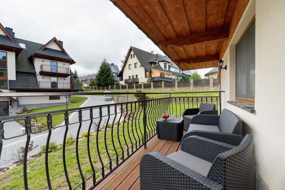 The balcony provides a serene environment for relaxation. 