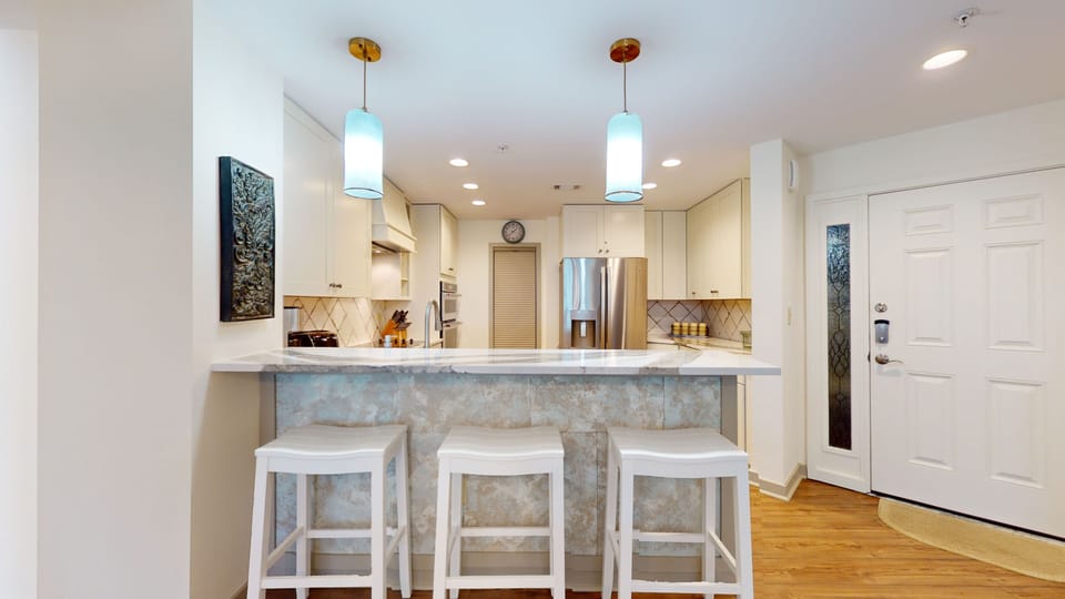 Fully Stocked Kitchen with Bar Seating