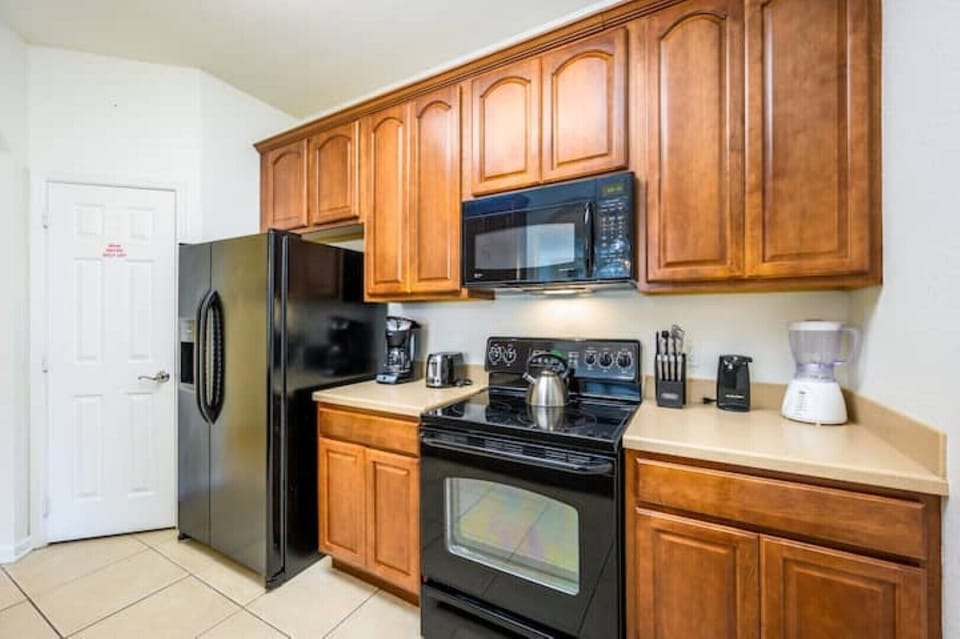 Kitchen with dishwasher, stove, micro, fridge w/ice & water, coffee maker, etc