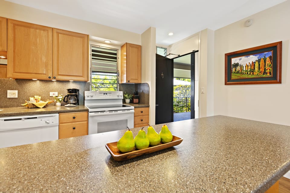Updated Kitchen with Bar Seating - Kitchen showing modern finishes and convenient bar seating.