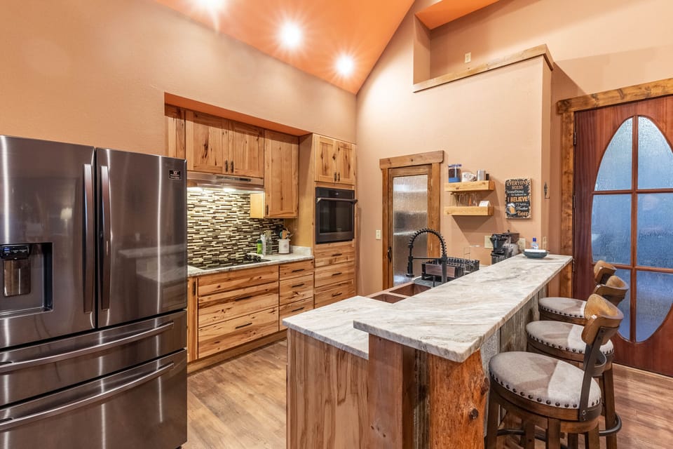 Kitchen - Kitchen with newer appliances and island bar with seating.