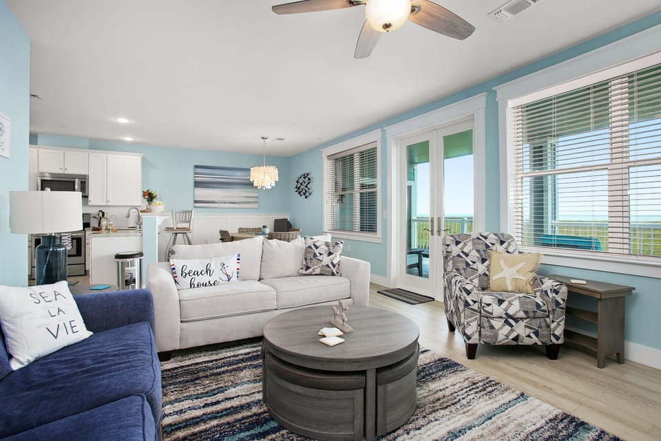 Spacious open floor plan with ocean views from living, dining & kitchen.