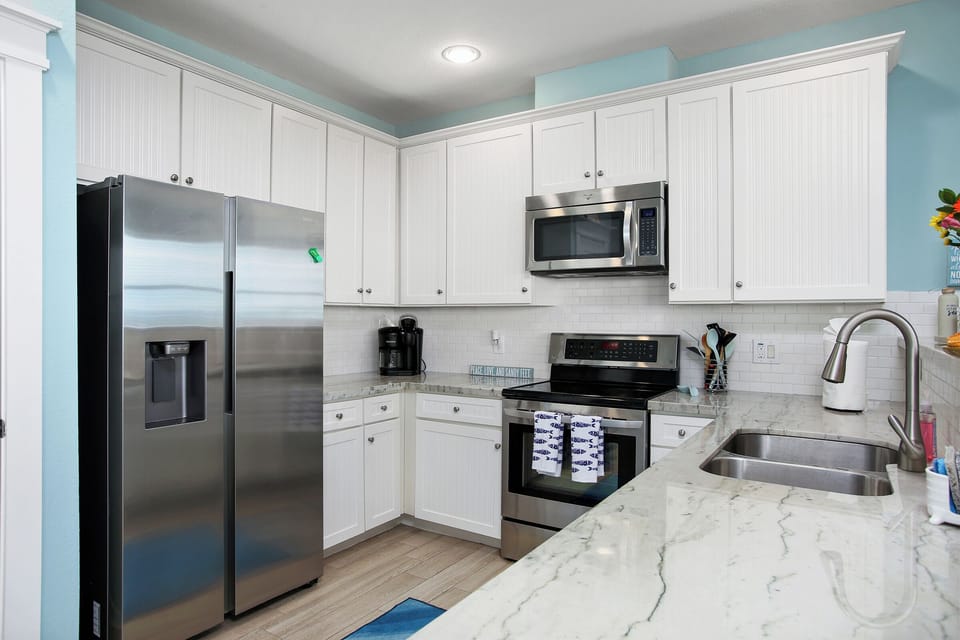 Fully stocked kitchen with all that you'll need to cook family meals. Blender, pots, pans & all cookware included.
