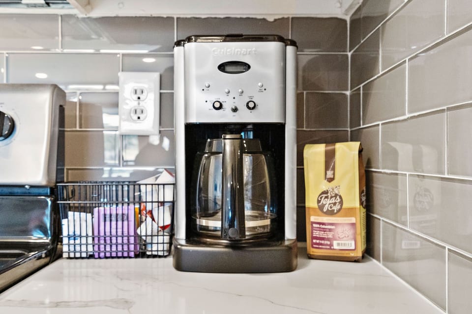 10 cup coffee pot with coffee & sweetener/creamer provided. Keurig also in unit.