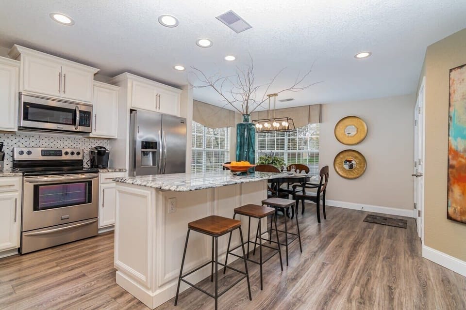 The dining table seats 6 or pull up a stool at the gorgeous kitchen island for a quick snack!
