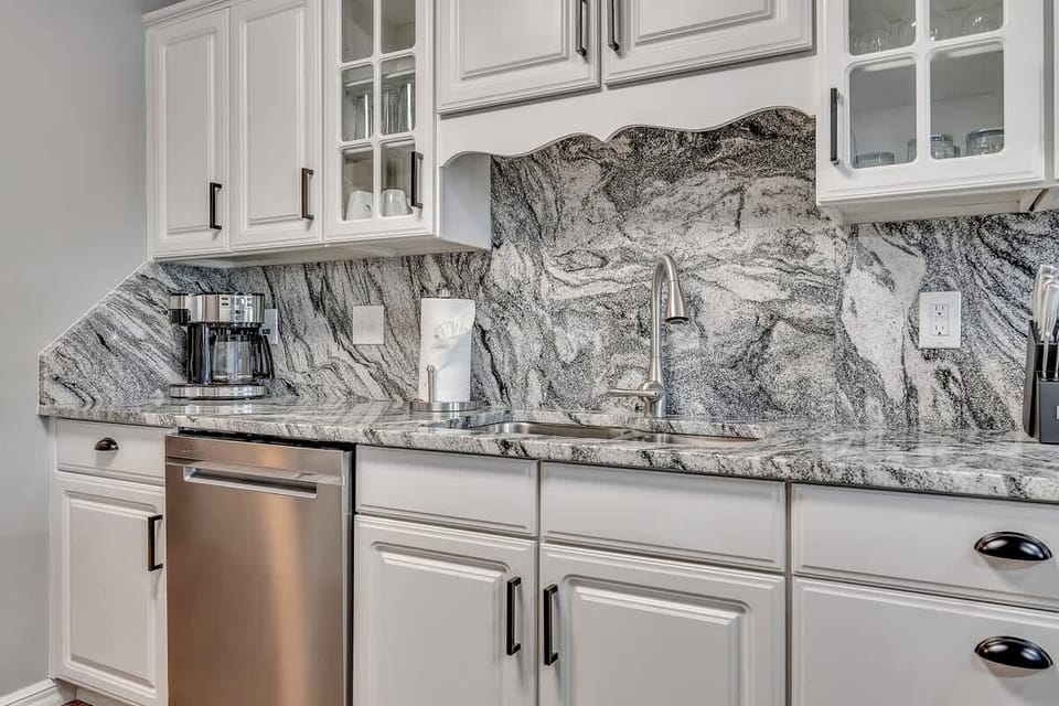 This upscale kitchen is complete with a regular coffee maker as well as a Keurig!