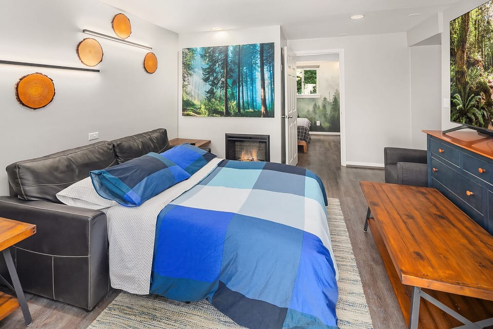 Living Room
- Couch pulls out to make a full size bed
- 75" Samsung Smart TV
