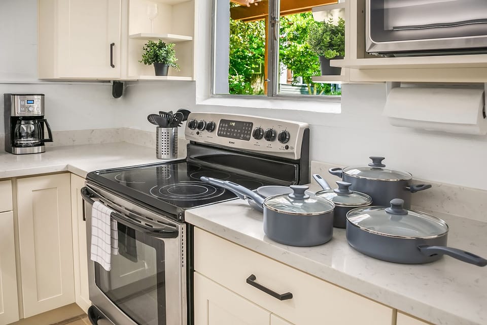 Kitchen includes a full set of dishes, utensils, pots and pans, spices.