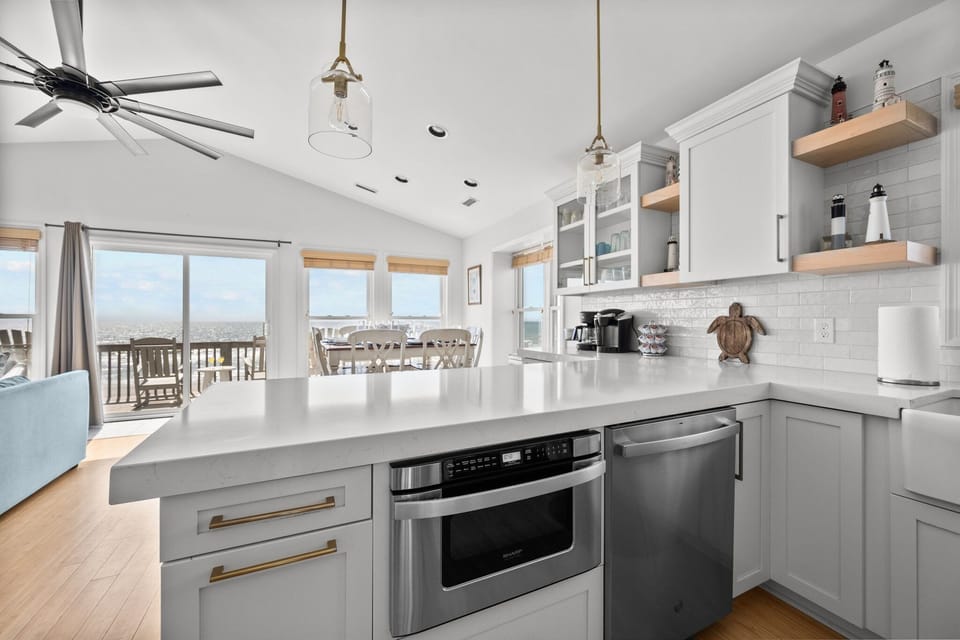 New kitchen is open to the dining and living areas, and you can take in ocean views while you prepare meals, snacks and cocktails