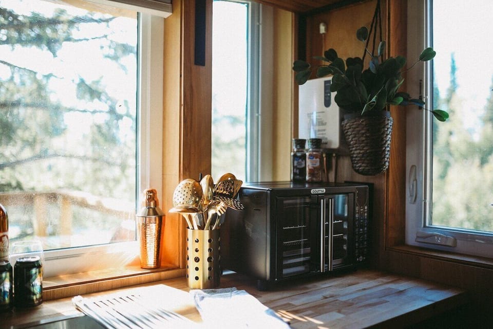 Enjoy the charming treehouse kitchen corner with natural light, perfect for preparing your favorite meals.