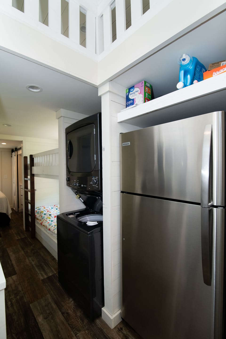 Full size fridge with ice-maker, washer-dryer and hall way to bunk area.
