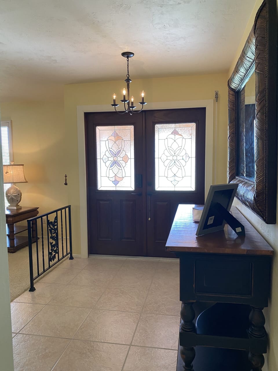 Secured entry to front door.  Credenza with welcome information.