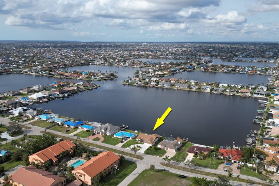 This lovely waterfront home is located on Britannia Lake, in the desirable Eight Lakes area on the south end of Cape Coral.