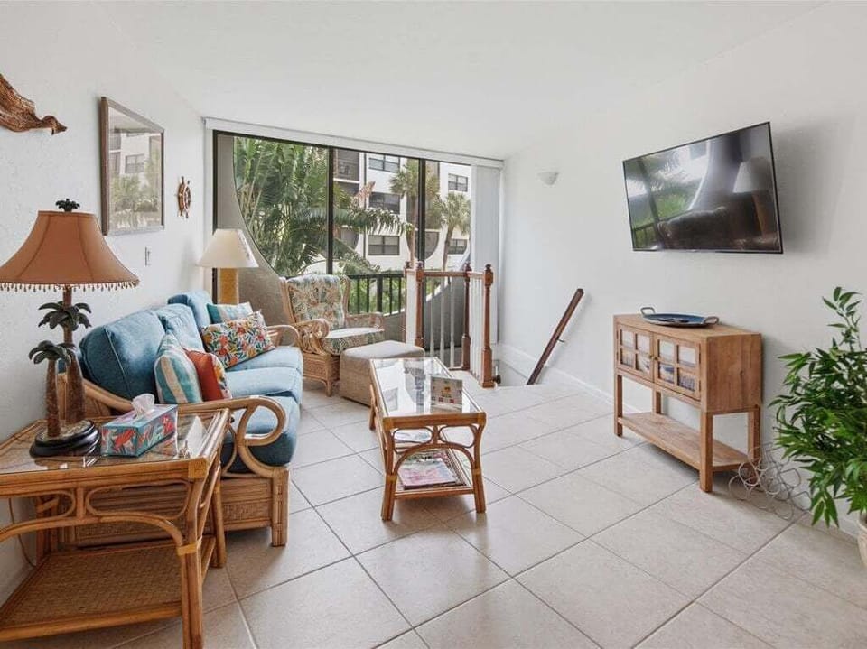living room with stairs to cabana