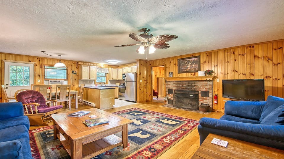 The living room offers plenty of seating, a gas fireplace, tv with streaming, and plenty of board games to enjoy.