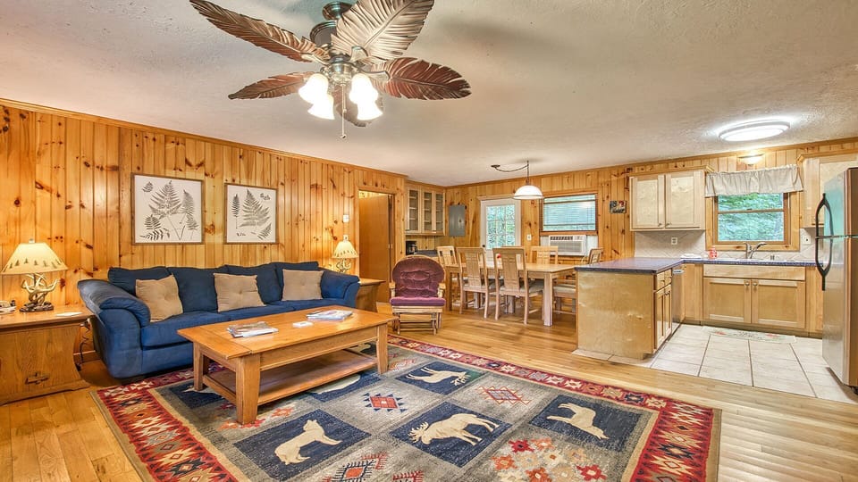 The living room offers plenty of seating, a gas fireplace, tv with streaming, and plenty of board games to enjoy.
