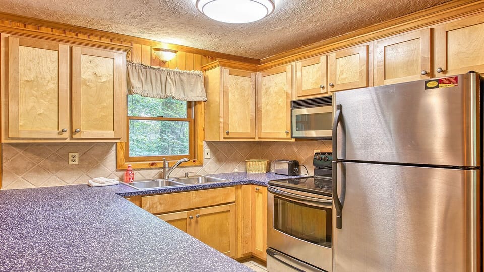 Full-sized kitchen perfect for home-cooked meals.