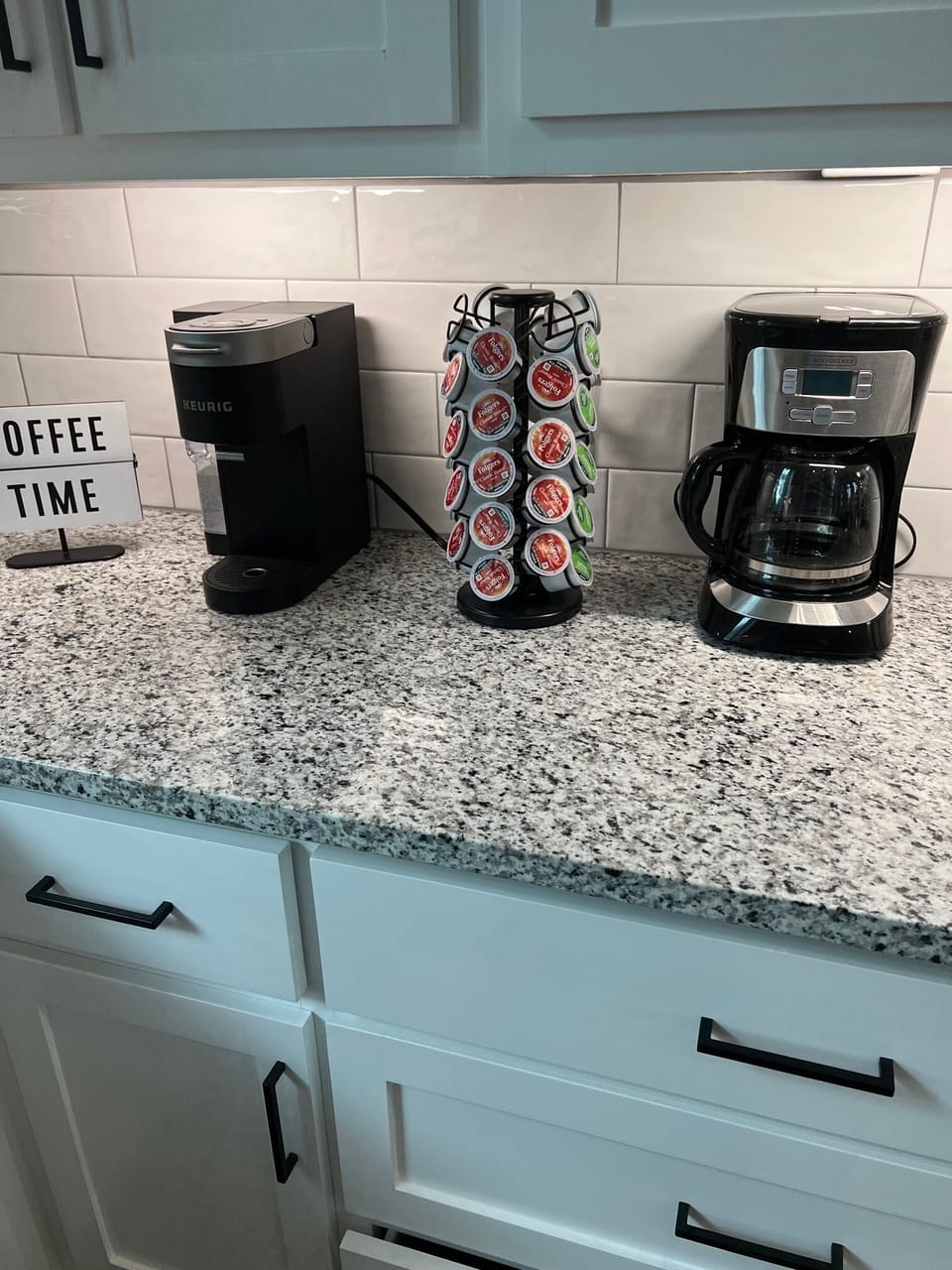Fully stocked coffee bar with both a traditional and kuerig coffee makers.