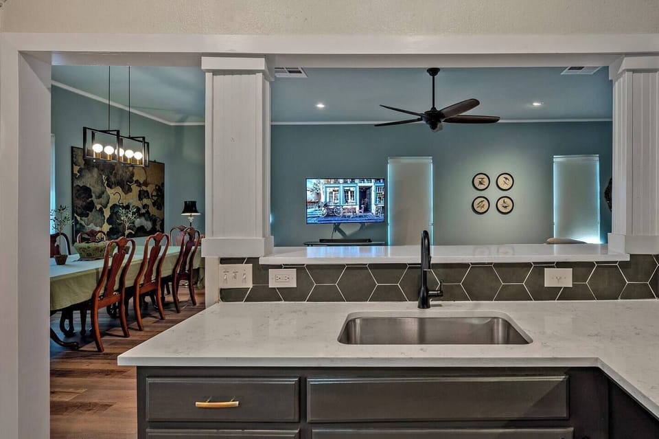 Kitchen over looks family room, TV and sectional