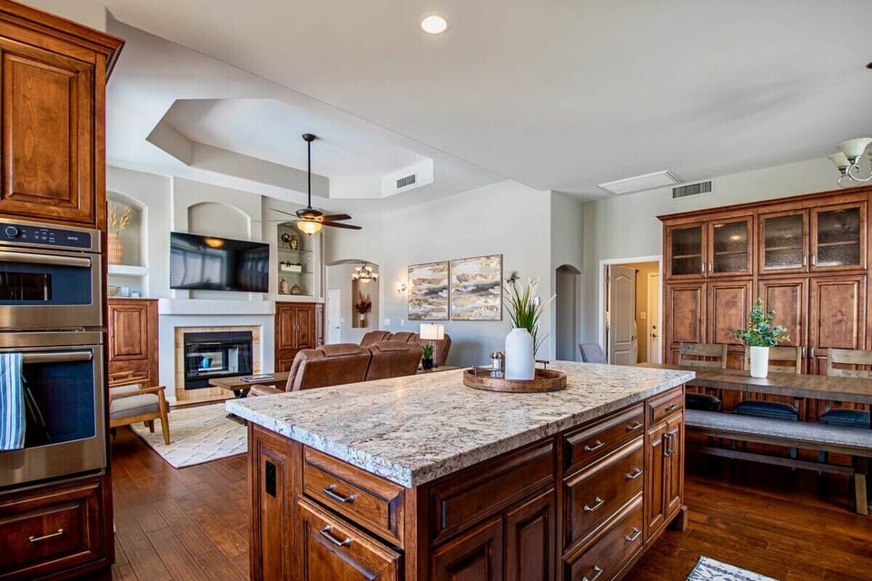 Open living area w/ kitchen island overlooking the living room.