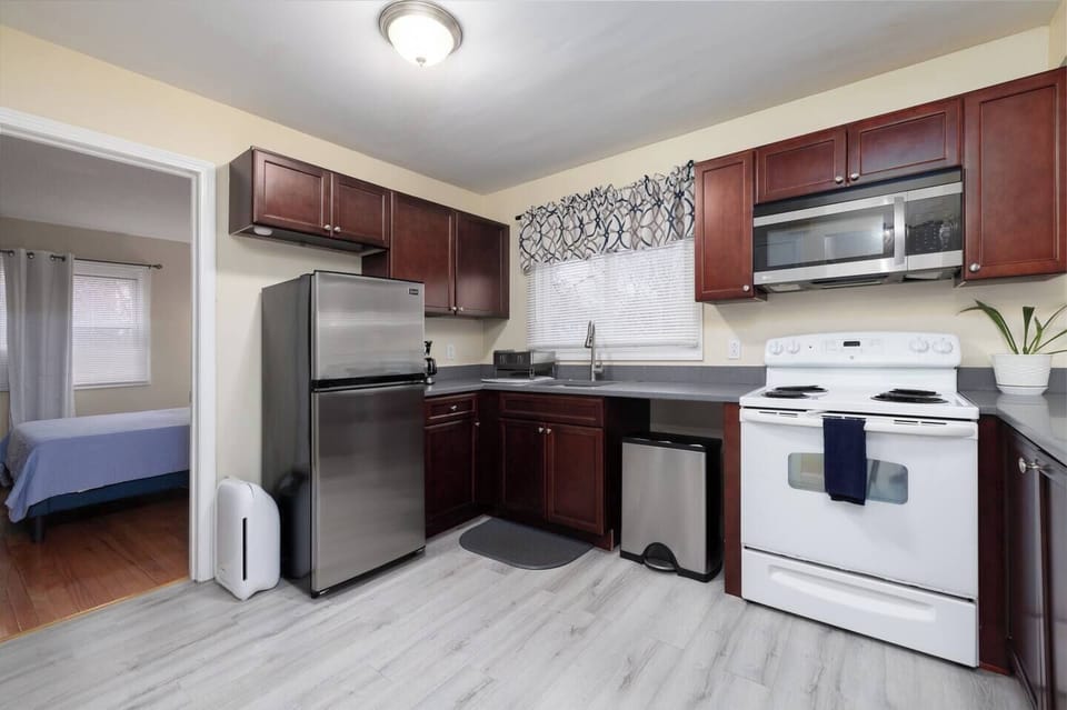 Fully equipped kitchen with kitchen essentials including air purifier