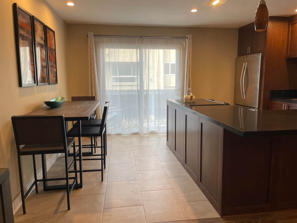 View to the dining area, kitchen and balcony