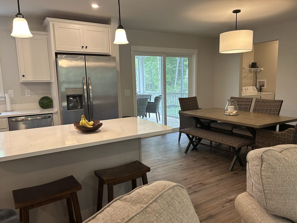 Kitchen and dining area with screened in porch off the dining area. 