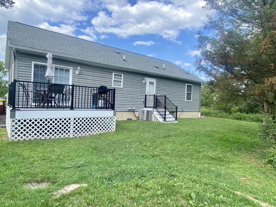 Back deck with patio table for 6, propane grill. The yard is NOT fenced in.