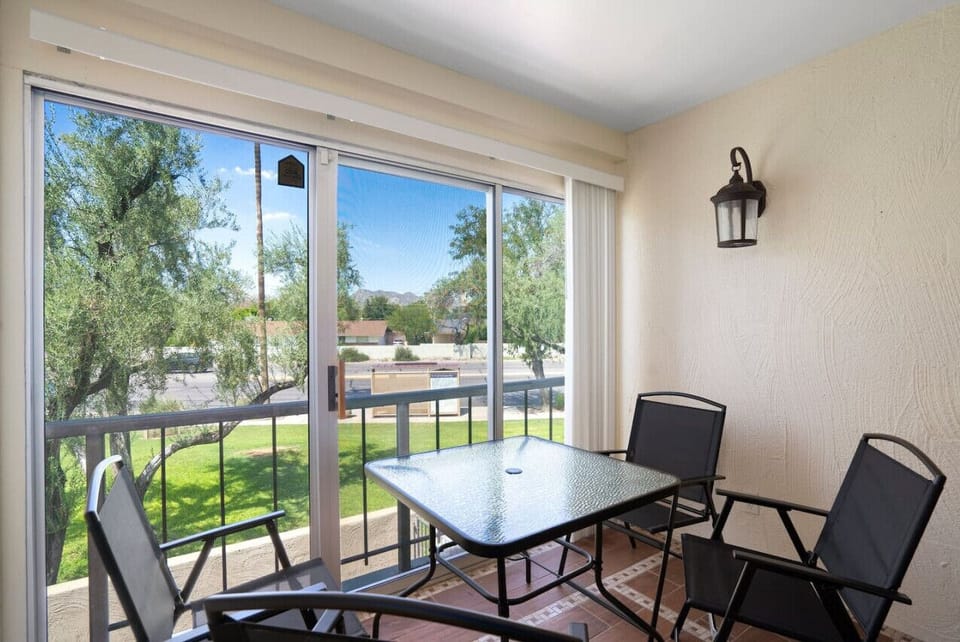 Savor your morning coffee with panoramic views of lush greenery and city vibes!
