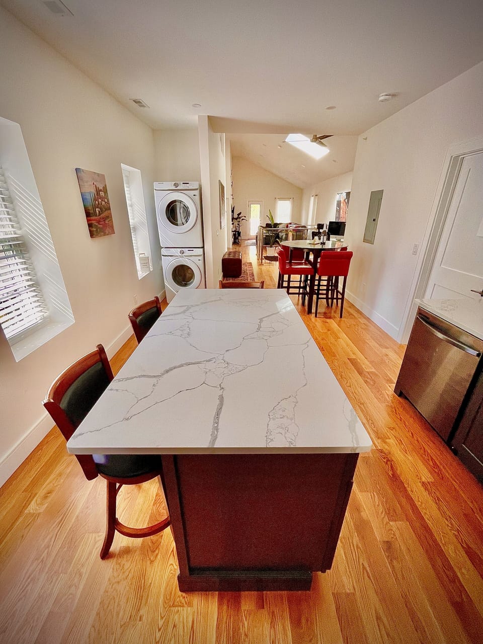 Kitchen area with washer and dryer
