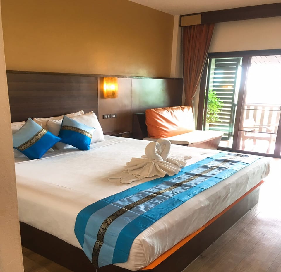 Superior Room, Balcony, Pool View | Living area | Flat-screen TV