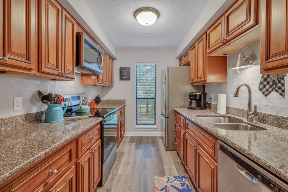 Large kitchen w/new pots & pans. Coffee pot makes k-cups or pot of coffee.