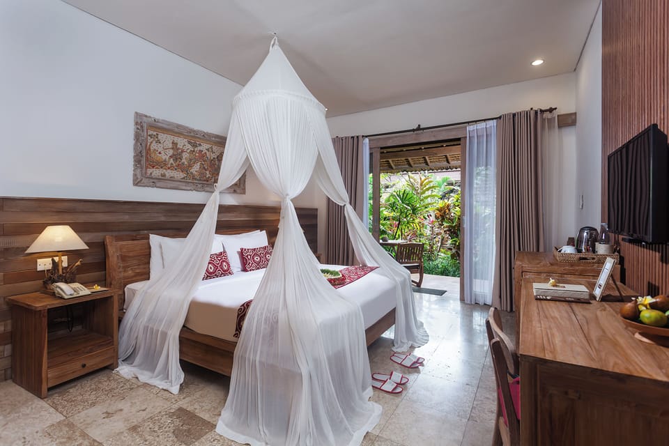 Suite with Garden View | Minibar, in-room safe, iron/ironing board, free WiFi