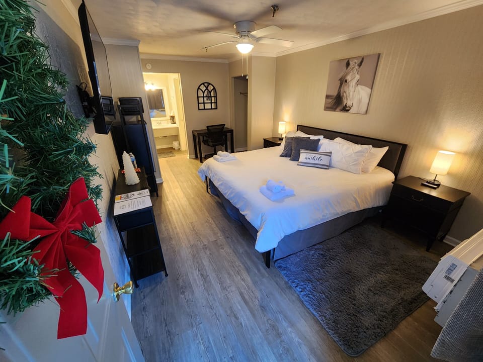 Downstairs Deluxe King Room | Memory foam beds, laptop workspace, blackout drapes, iron/ironing board