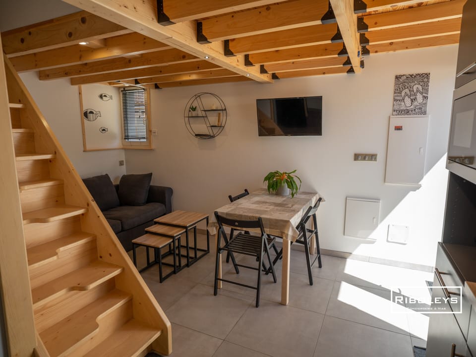 Kitchen opening onto living/dining room