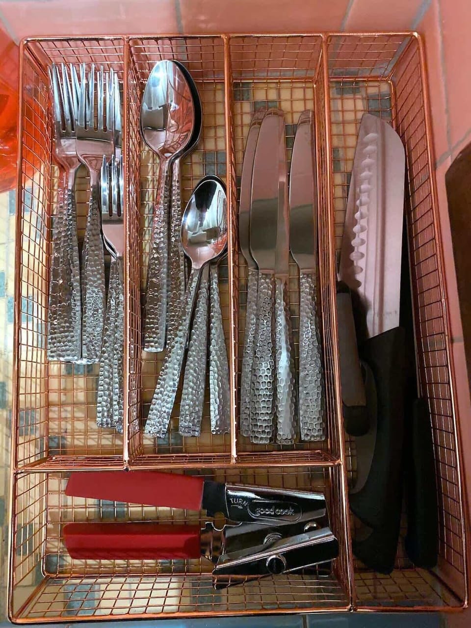 Kitchenette with sink, silverware and dishes...