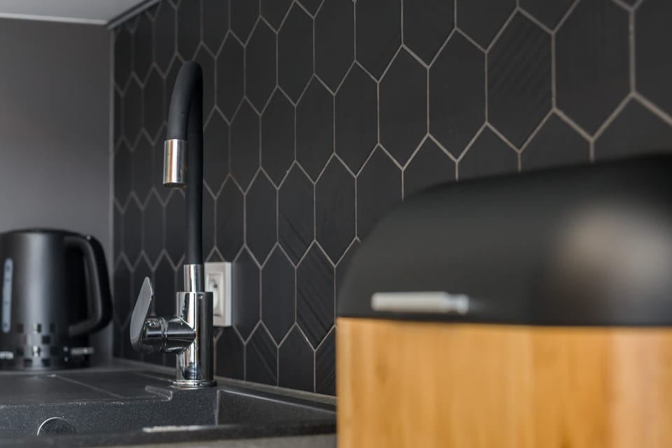 The kitchen offers a functional layout for convenient cooking. 