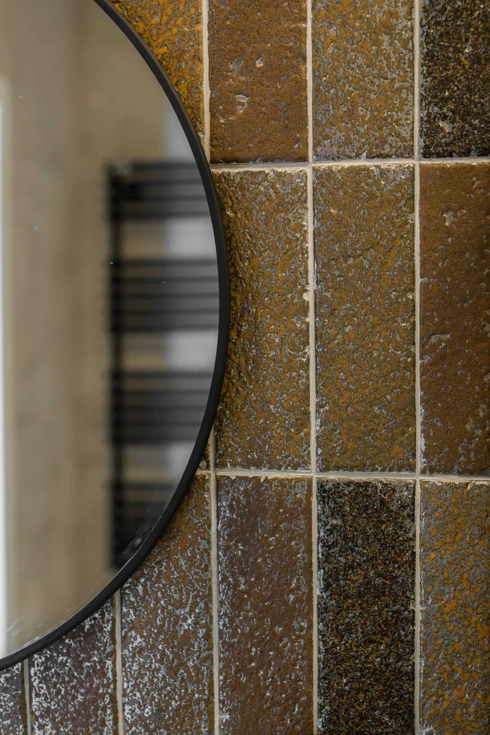 The bathroom's contemporary decor complements the apartment's style. 