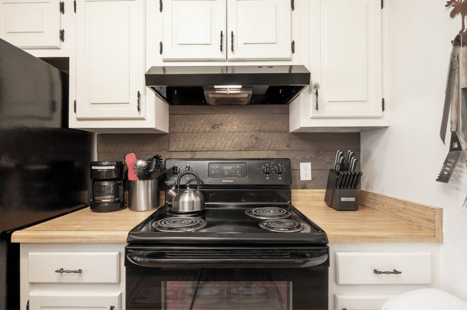 Your fully equipped kitchen awaits with modern appliances, butcher block counters, and everything you need to create memorable meals together.