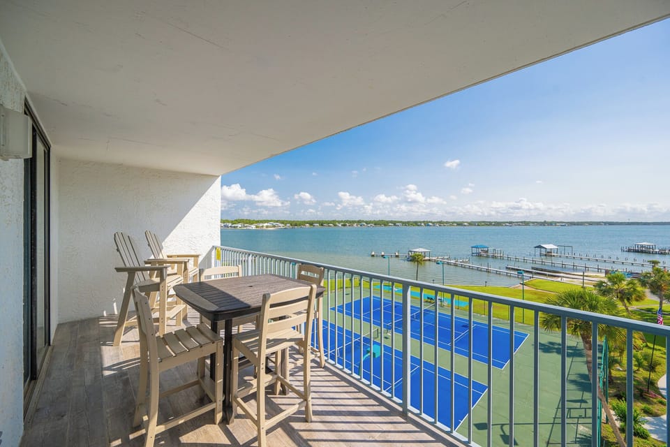 Relax and unwind on your balcony while enjoying stunning views of the lagoon and nearby tennis courts