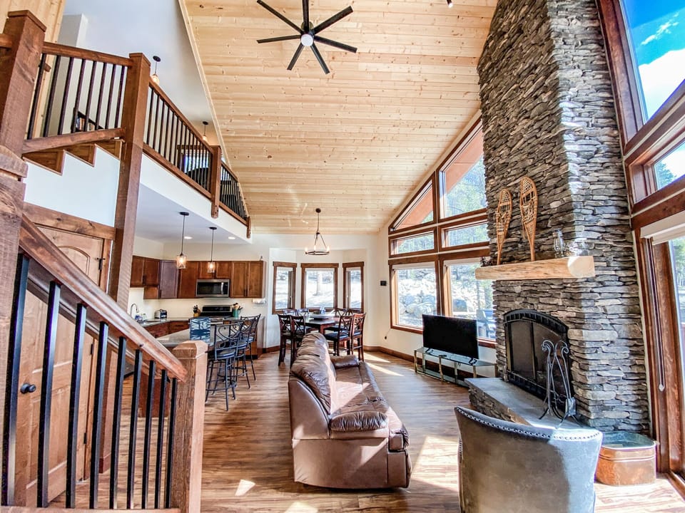 Upon entering the home, you are greeted by the floor to ceiling windows and sliding glass doors of the Great Room