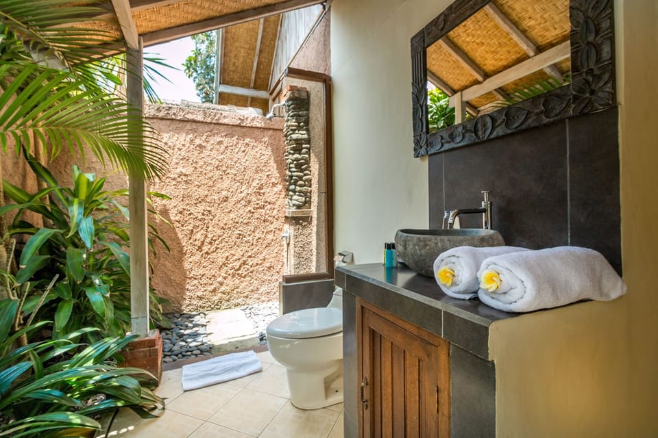 Joglo Villa | Bathroom | Shower, rainfall showerhead, hair dryer, soap