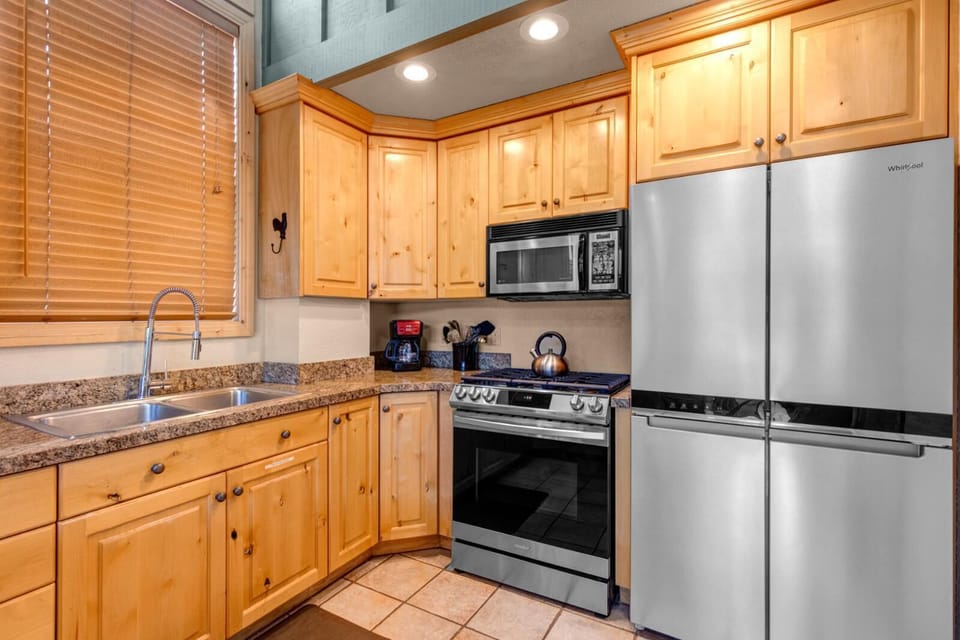 Your open kitchen offers everything you need to prep hearty meals, from morning coffee to après-ski feasts.