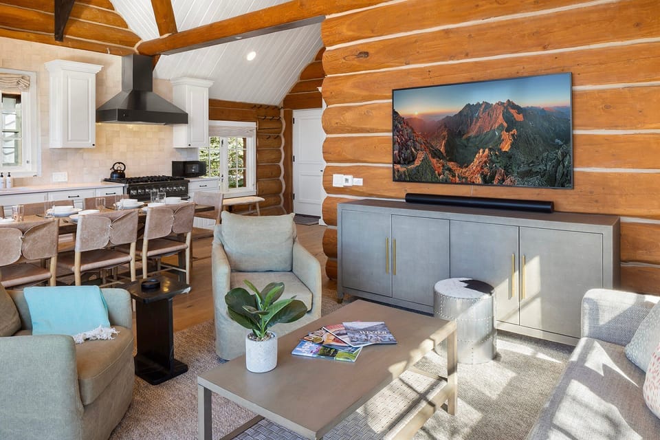 Cozy living area with private deck, gas grill all overlooking the kitchen dining area.