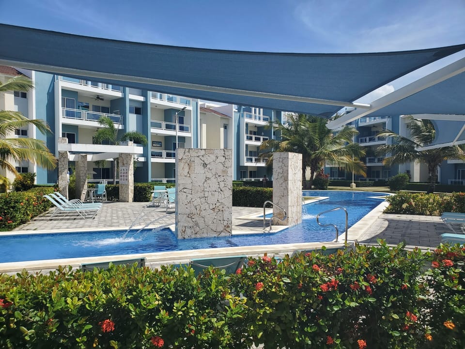 outdoor pool with seating and lounging area